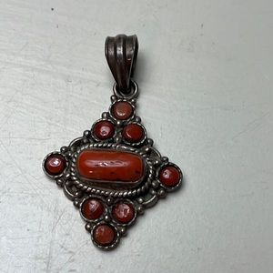 Pd14. Beautiful orange stone pendant in sterling.